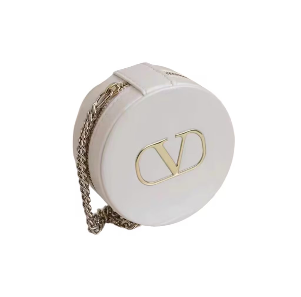 Need a versatile Valentino makeup pouch that doubles as a chic mini chain bag?